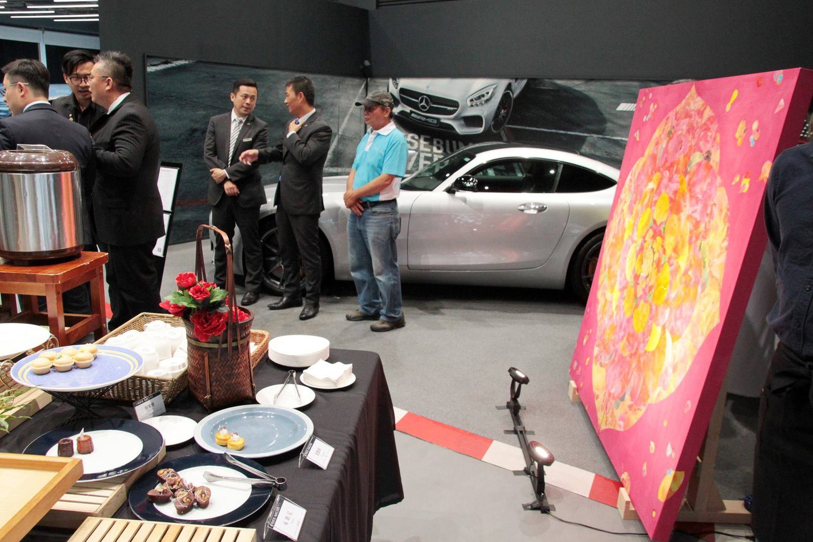 Mineral paintings on easels at the Mercedes-AMG launch showroom