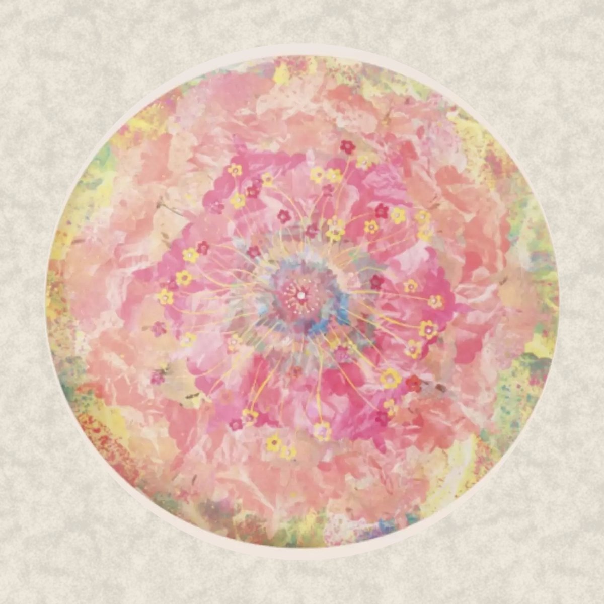 Vishuddha, 2023. A round mineral painting in pink and peach with small yellow flower motifs and crystal, on an ivory ground