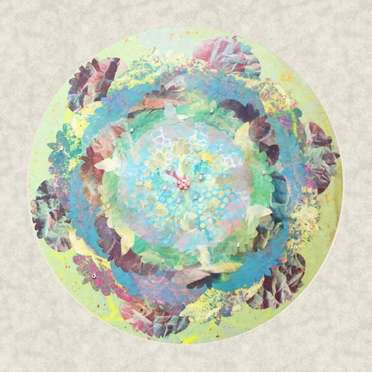 Awakening, 2023. A round mineral painting in green, teal and blue with plum-coloured crinkled petals, on an ivory ground